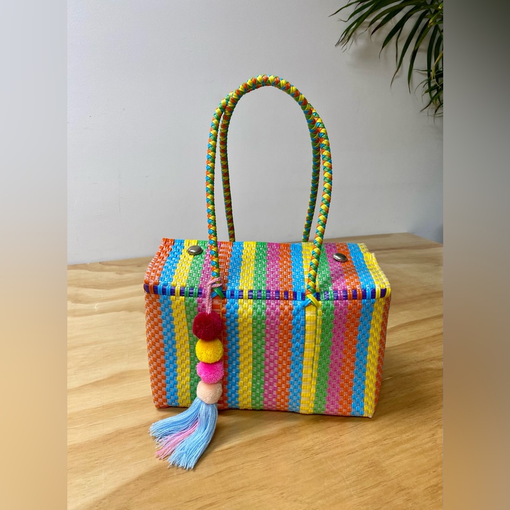 bright + colourful woven Mexican artisan handbag with pom-pom tassle